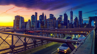 City skyline bridge cars sunset - a city skyline in the background free wallpaper