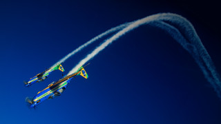 Airplanes sky smoke trails blue - a blue sky behind them free wallpaper