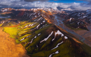 Mountain range snow green grass - a view of a mountain range free wallpaper