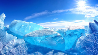 Floating iceberg sun blue sky - a bright sun in the background free wallpaper
