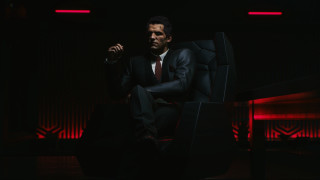 Man in suit sitting red - a chair free wallpaper for desktop