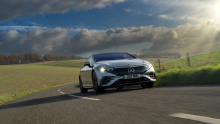 Silver car green field tilt - a lush green field free wallpaper