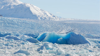 Large iceberg mountain person snow - ecological art free wallpaper