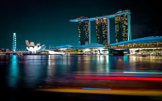 City skyline river night lights 14 - the water and a boat in the foreground free wallpaper