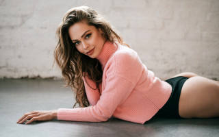 Woman pink sweater black shorts - a pink sweater free wallpaper
