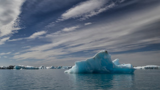 Iceberg floating lake cloudy sky - a few iceberg free wallpaper