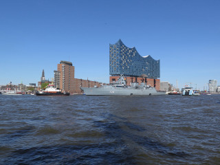 Large ship city tall buildings - panoramic view free wallpaper