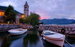 Boats wall clock tower mountain - a couple of boats free wallpaper