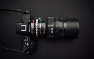 Camera lens strap black surface - a len free wallpaper