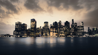 City skyline night cloudy mountains - tall building free wallpaper