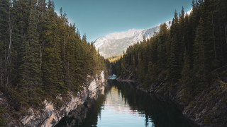 River trees mountains boat snowy - the water and a mountain in the background free wallpaper for desktop