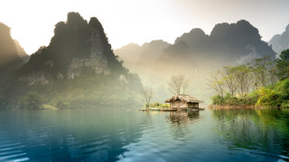 Hut island lake mountains fog - a hut free wallpaper