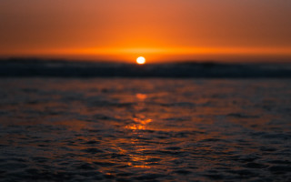 Sunset ocean wave shore cloudy - free sunset wallpaper