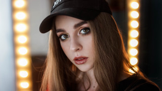 Woman baseballcap mirror lights portrait - a baseball cap free wallpaper