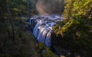 Waterfall forest sunbeam puzzle lens - a waterfall in the middle of a forest free wallpaper