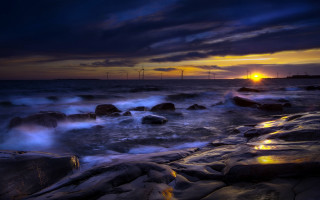 Sunset ocean waves rocks windmills - a sunset over the ocean free wallpaper