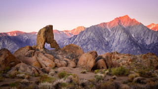 Rocky mountain range purple sky - a purple sky in the background free wallpaper for desktop