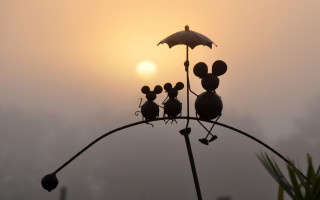 Mice metal pole umbrella sunset - a surrealist sculpture free wallpaper
