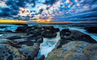 Sunset rocky beach waves clouds - colorful cloud free wallpaper