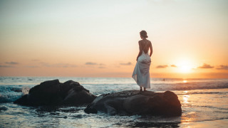 Woman ocean rock sunset beach - a rock in the ocean free wallpaper