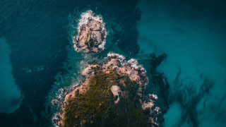 Boat rocky shore microscopic night - aerial view free wallpaper for desktop