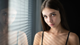 Woman reflection necklace fence portrait - her neck and a necklace free wallpaper