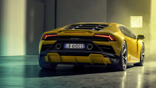 Yellow sports car garage front - a number plate free wallpaper
