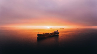 Cargo ship ocean sunset mountain - arie smit free wallpaper