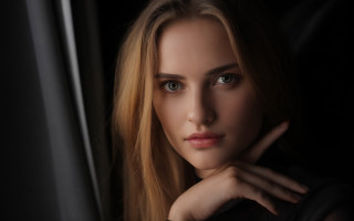 Blonde woman blue eyes dark - a window behind her free wallpaper