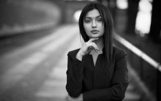 Woman trainstation serious blackandwhite portrait - a train station free wallpaper