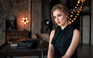 Woman typewriter city bokeh photorealistic - a woman sitting free wallpaper