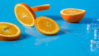 Oranges halved ice blue surface - a blue surface free wallpaper for desktop