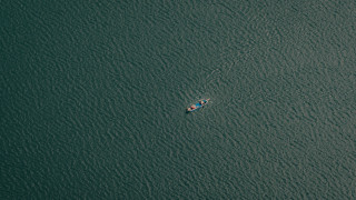 Ocean boat paddle tranquil minimalism - the water and a boat free wallpaper