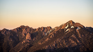 Mountain range sunset snow capped - a clear sky free wallpaper