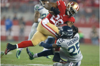 Football player tackled game field - a football player free wallpaper