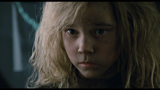 Close up blonde hair serious - a close up of a person free wallpaper