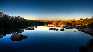 River bridge trees sunset rocks - american romanticism free wallpaper for desktop