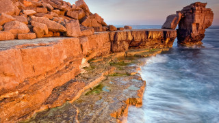 Rocky cliff water formation autumn - a large rock formation in the foreground free wallpaper