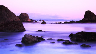 Rocky beach purple sky mountains - a purple sky in the background free wallpaper