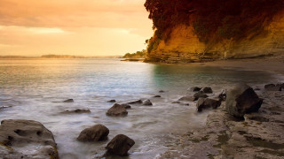 Rocky beach cliff ocean sunset - a rocky beach free wallpaper