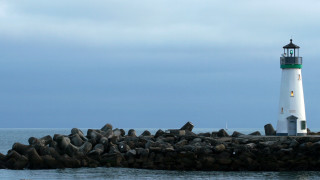 Lighthouse rocky pier water cloudy - free ship wallpaper