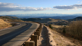 Mountain road fence sky ocean - a fence free wallpaper