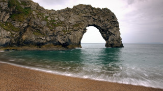 Rock formation ocean beach wave - a beach below free wallpaper
