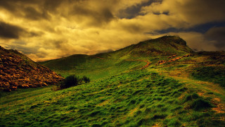 Grassy hill field cloudy sky 2 - a grassy field below free wallpaper for desktop
