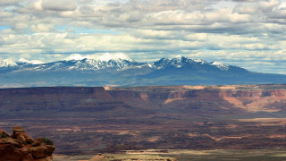 Mountain range snow capped sky - a few snow free wallpaper