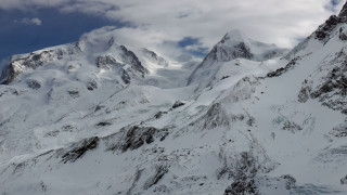Snowy mountain cloudy sky panorama - a few snow covered mountains free wallpaper