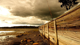 Fishing fence water cloudy sky - a fishing rod free wallpaper