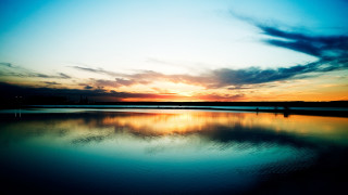 Sunset lake shore person clouds - free beach wallpaper