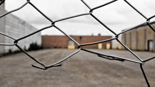Chainlink fence parkinglot buildings utilitypole - mesh wire free wallpaper