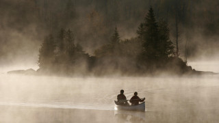 Canoe fog lake trees sky - a foggy sky free wallpaper